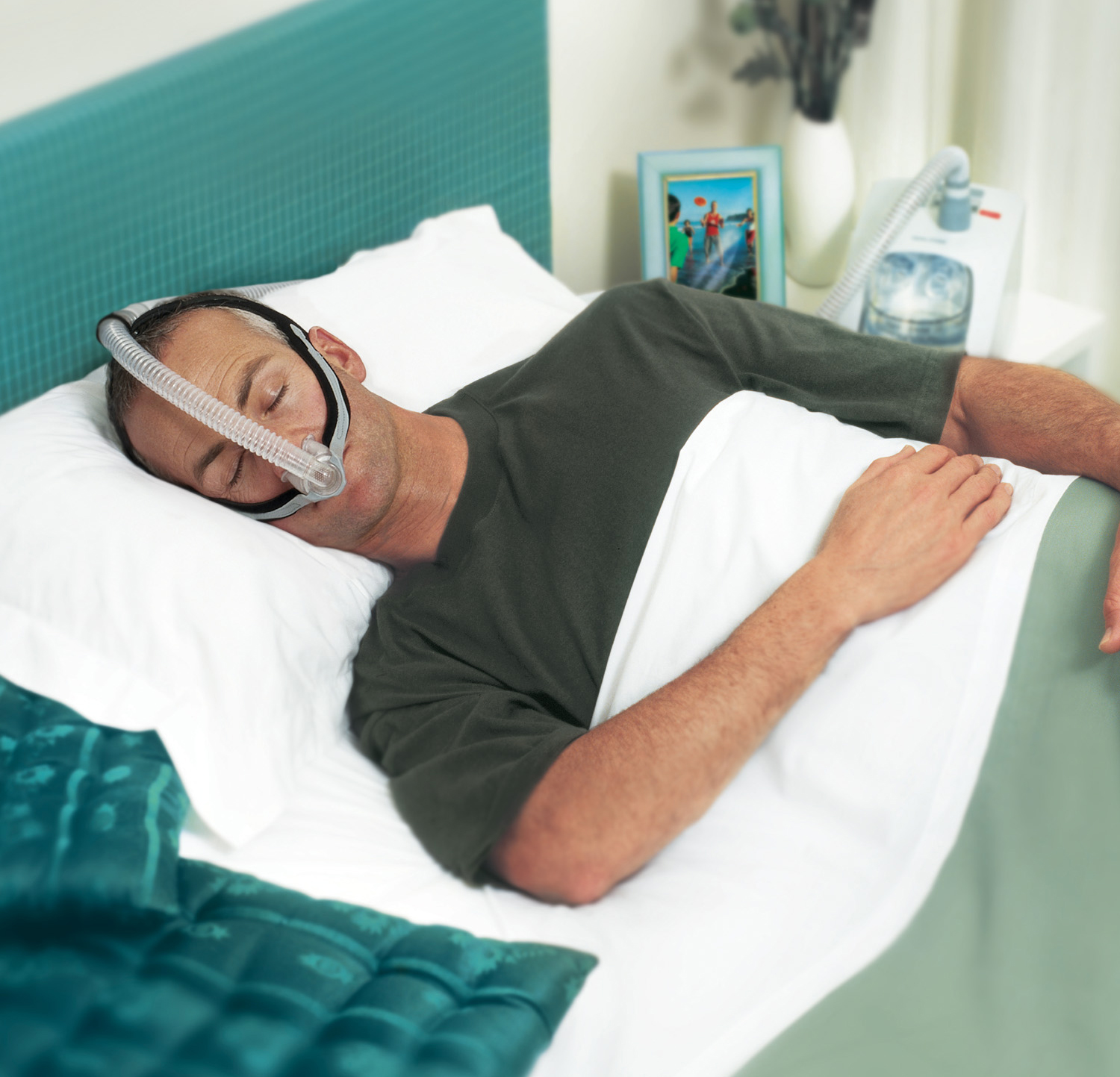 Man in Bed With Opus CPAP Mask
